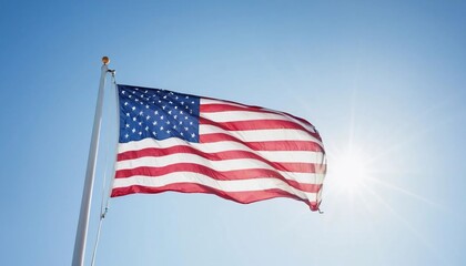 Obraz premium American Flag Waving in Blue Sky with Sun