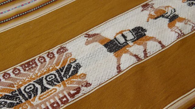 traditional hand woven fabric from peru, bolivia, ecuador, with andean designs, llamas. Aguayo woven by native people of the andes.