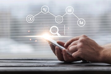 Businessman hold SEO icon at virtual screen