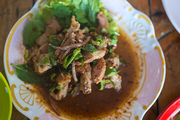 Spicy thai grilled pork salad called 