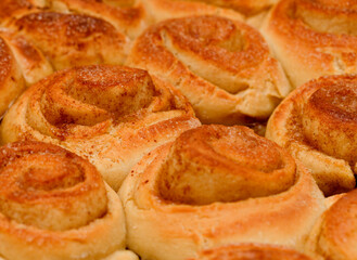 freshly made tray of cinnamon rolls, macro food background