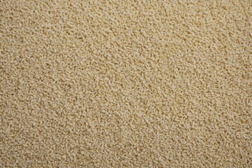 ivory color rough textured background with copy space, background for wallpaper, minimal flat lay.