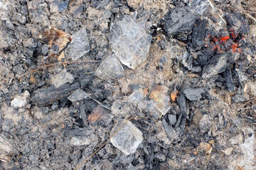 gray white texture of ash with sand and white snow in the street
