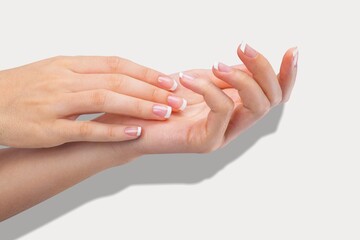 A pair of beautiful female hands on background