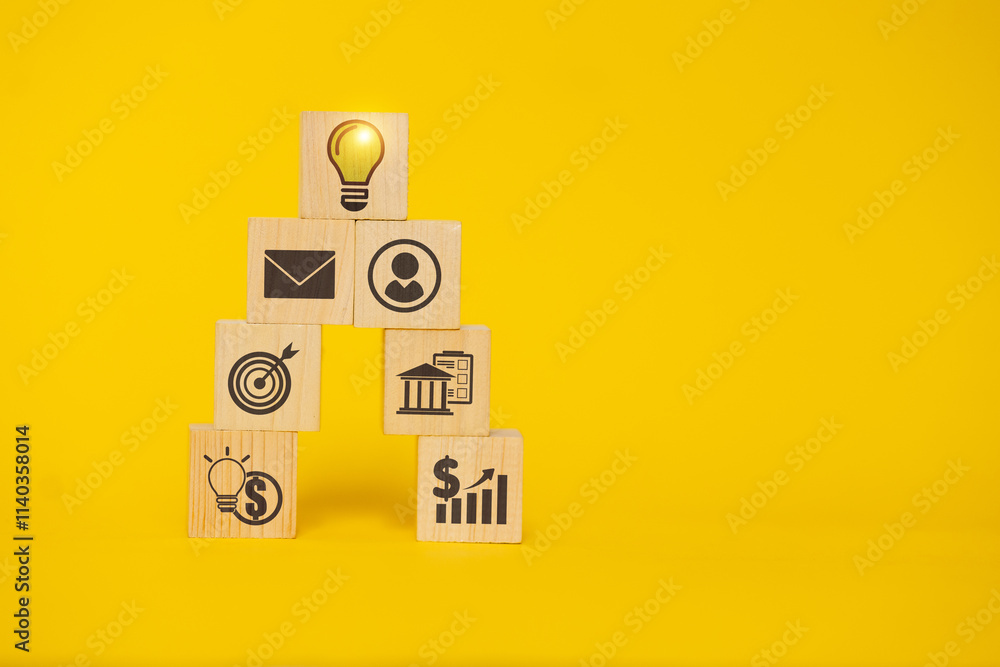 Poster a stack of wooden blocks with a light bulb on top and a dollar sign on the bottom. the blocks are la