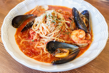 Italian Seafood Pasta in Spicy Tomato Sauce with Mussels, Shrimp and Fresh Herbs