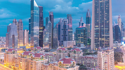 Skyline view of the buildings of Sheikh Zayed Road and DIFC night to day timelapse in Dubai, UAE.