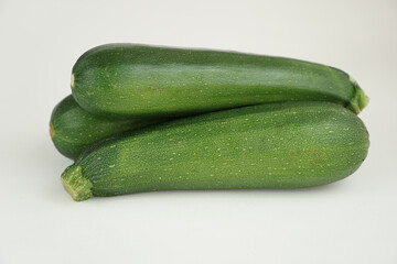 Fresh green zucchini isolated on white background