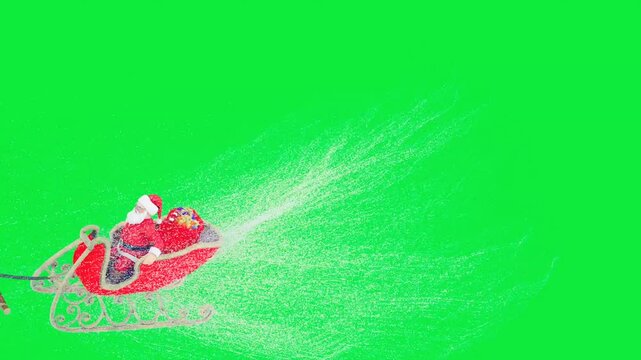 Santa Claus is flying on a Christmas sleigh with reindeer.