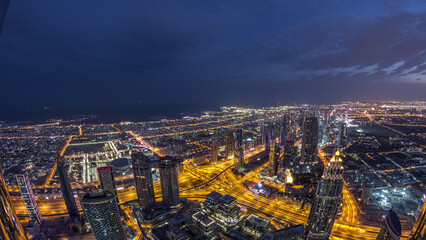 Downtown of Dubai night to day timelapse before sunrise. Aerial view with towers and skyscrapers