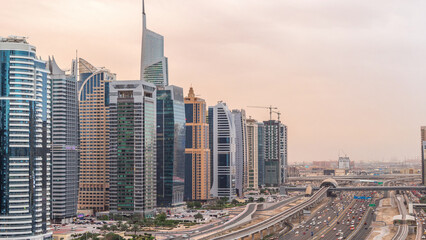 Fototapeta premium Aerial top view to Sheikh Zayed road near Dubai Marina and JLT day to night timelapse, Dubai.