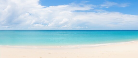 Obraz premium serene beach scene featuring soft white sand clear turquoise waters and a bright blue sky with fluffy clouds.
