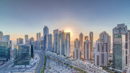 Modern residential and office complex with many towers aerial timelapse at Business Bay, Dubai, UAE.