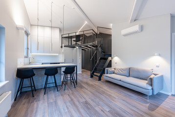 Modern Luxury Home Loft Apartment Kitchen And Living Room Interior with Stylish Mezzanine and Minimalist Design