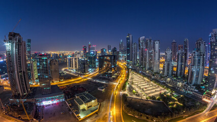 Fototapeta premium Panorama of Business bay Dubai night to day aerial timelapse.