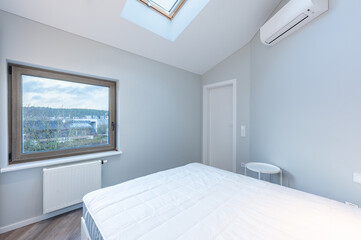Modern Minimalist Luxury Home Bedroom Interior with King Size Bed and Natural Light. AC on the Wall