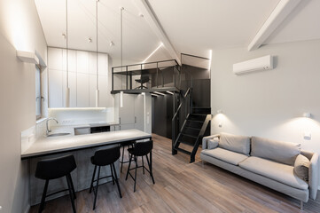 Modern Luxury Home Loft Apartment Kitchen And Living Room Interior with Stylish Mezzanine and Minimalist Design