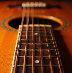 Fototapeta premium Close-up of acoustic guitar strings and fretboard