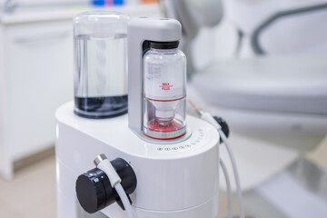 Dental Air Flow system for oral hygiene, featuring a powder and water container, designed for cleaning and whitening teeth with precision