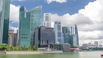 Fototapeta premium Business Financial Downtown City and Skyscrapers Tower Building at Marina Bay timelapse hyperlapse, Singapore,