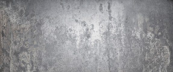 Metal surface showing weathered texture and subtle color variations in industrial grunge setting.