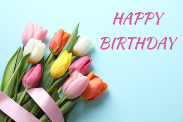 Beautiful bouquet of tulip flowers  on color background. Happy Birthday concept