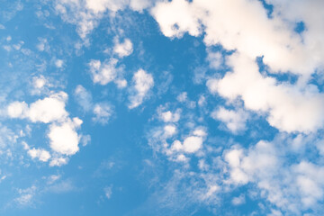 Blue Sky with Wispy Clouds at Sunset. This sky photo is perfect for backgrounds, themes of tranquility, nature, or freedom, and can be used in designs related to relaxation, inspiration or the outdoor