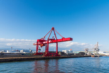 Container port and container crane at Industrial port for cargo container ship Osaka Japan. Business logistic transportation concept.