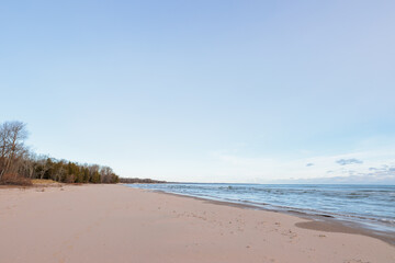 The quiet, empty beach at Harrington Beach State Park, Belgium, Wisconsin in mid-December, along the shoreline of Lake Michigan