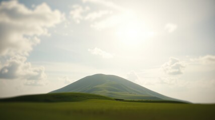 Obraz premium Serene landscape featuring a gently sloping hill under a bright, partly cloudy sky