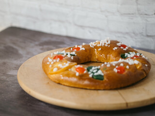 typical spanish christmas cake roscón de reyes on a plate
