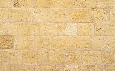 Large sandstone blocks wall texture, Old weathered stone wall background