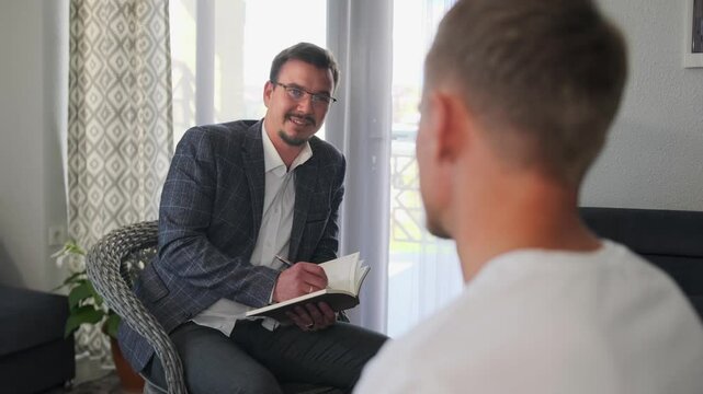 Psychologist uses gestures during lively discussion with a patient.