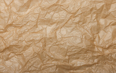 Crumpled brown paper texture creating abstract pattern background