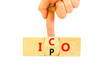 Initial public or coin offering symbol. Concept words abbreviation IPO or ICO on wooden block....