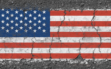 Grunge damaged American flag on cracked concrete