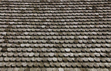 Traditional wooden roof shingles creating a textured surface