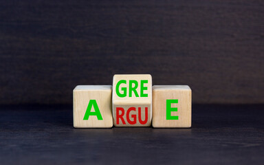 Agree or argue symbol. Concept words Agree or Argue on wooden block. Beautiful black table black...