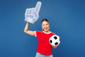 Young woman fan wear basic red t-shirt foam 1 fan glove finger up point overhead cheer up support...