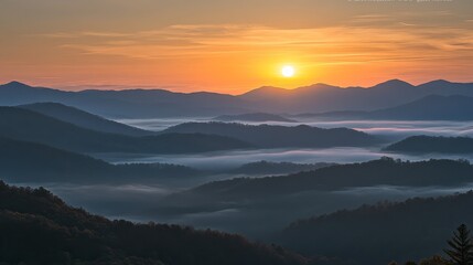 Obraz premium A serene sunrise over misty mountain, stunning, background, capturing the beauty of nature at dawn.