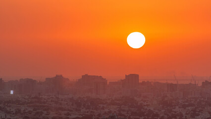 Sunset in Ajman aerial view from rooftop timelapse. United Arab Emirates.