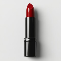 Obraz premium Bright red lipstick displayed on a smooth surface in a minimalist setting during daylight