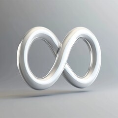 Fototapeta premium A sleek, metallic infinity symbol artfully displayed against a soft gray background.