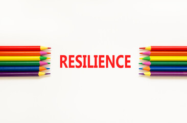 Resilience symbol. Concept word Resilience on beautiful white paper. Beautiful white paper background. Beautiful colored pencils. Business resilience concept. Copy space.