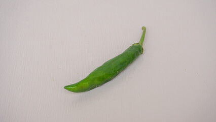 Fresh green chili pepper isolated on a white background