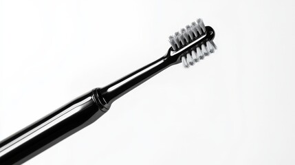 Sleek black electric toothbrush on minimalist white background