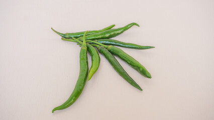 Fresh green chili pepper isolated on a white background