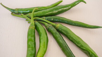 Fresh green chili pepper isolated on a white background