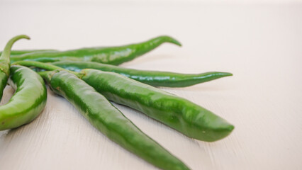 Fresh green chili pepper isolated on a white background