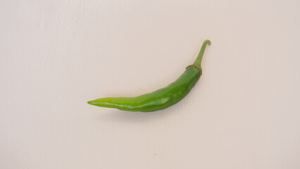 Fresh green chili pepper isolated on a white background